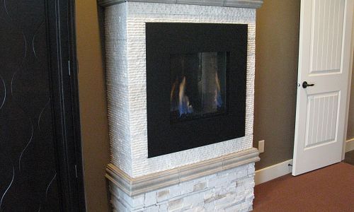 This modern gas fireplace is a "Soho" gas fireplace and has many different fronts available to change the look.